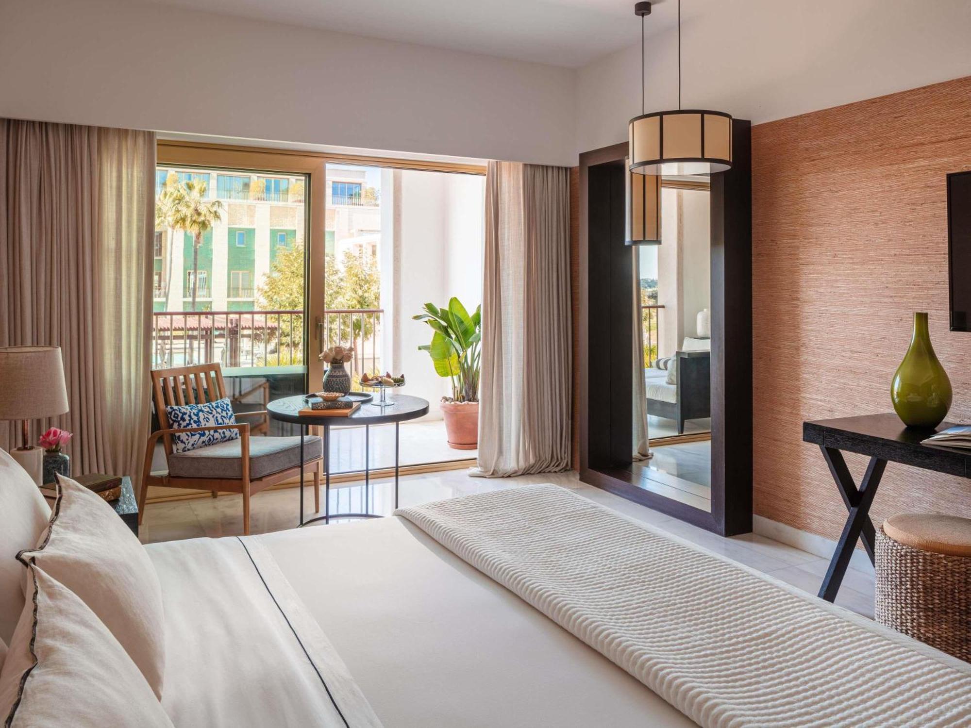 One-Bedroom Suite with Palms Pool View and Balcony